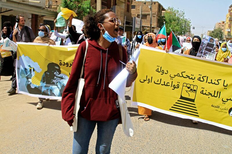 Sudanese rally to mark the International Women's Day in Sudan's capital Khartoum, on March 8, 2022.  (Photo by Ebrahim Hamid  /  AFP)