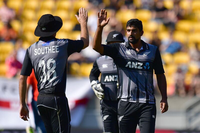 New Zealand's Ish Sodhi (R) celebrates with Tim Southee after taking the wicket of England's Sam Billings during the Twenty20 cricket match between New Zealand and England at Westpac Stadium in Wellington on November 3, 2019. / AFP / Marty MELVILLE
