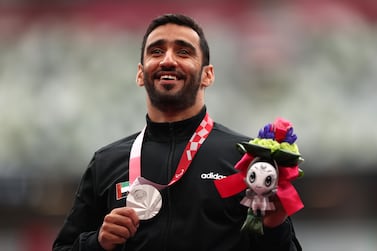 TOKYO, JAPAN - SEPTEMBER 04: Silver medalist Mohamed Alhammadi of Team United Arab Emirates poses on the podium during the medal ceremony for the Men’s 800m - T34 Final on day 11 of the Tokyo 2020 Paralympic Games at Olympic Stadium on September 04, 2021 in Tokyo, Japan. (Photo by Naomi Baker / Getty Images)