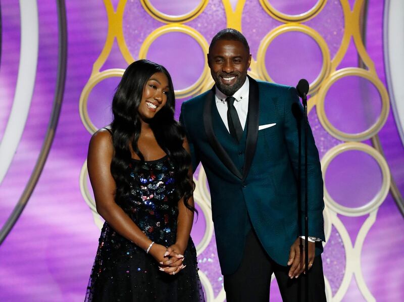 This image released by NBC shows Isan Elba, left, with her father, actor Idris Elba during the 76th Annual Golden Globe Awards at the Beverly Hilton Hotel on Sunday, Jan. 6, 2019 in Beverly Hills, Calif. (Paul Drinkwater/NBC via AP)