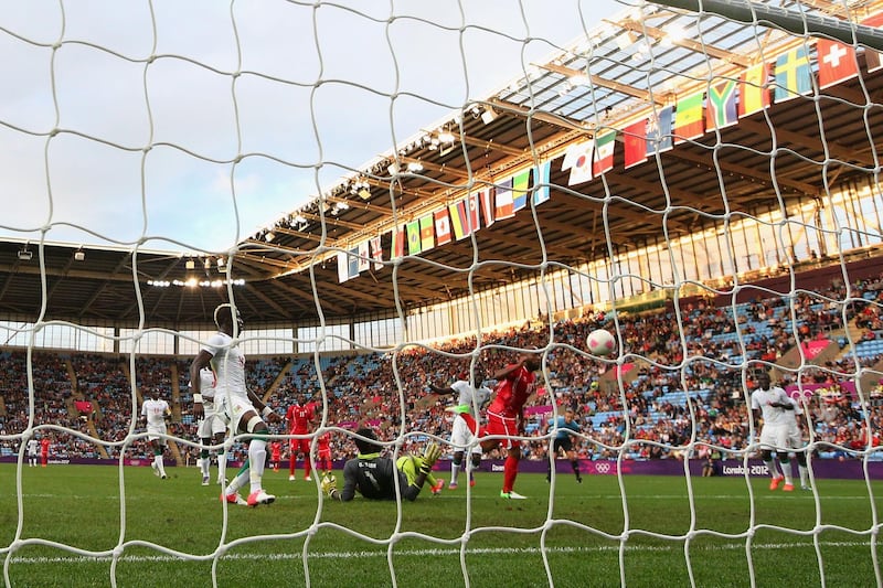 COVENTRY, ENGLAND - AUGUST 01:  Ismaeil Matar of United Arab Emirates scores a goal during the Men's Football first round Group D Match between Senegal and United Arab Emirates, on Day 5 of the London 2012 Olympic Games at City of Coventry Stadium on August 1, 2012 in Coventry, England.  (Photo by Cameron Spencer/Getty Images)