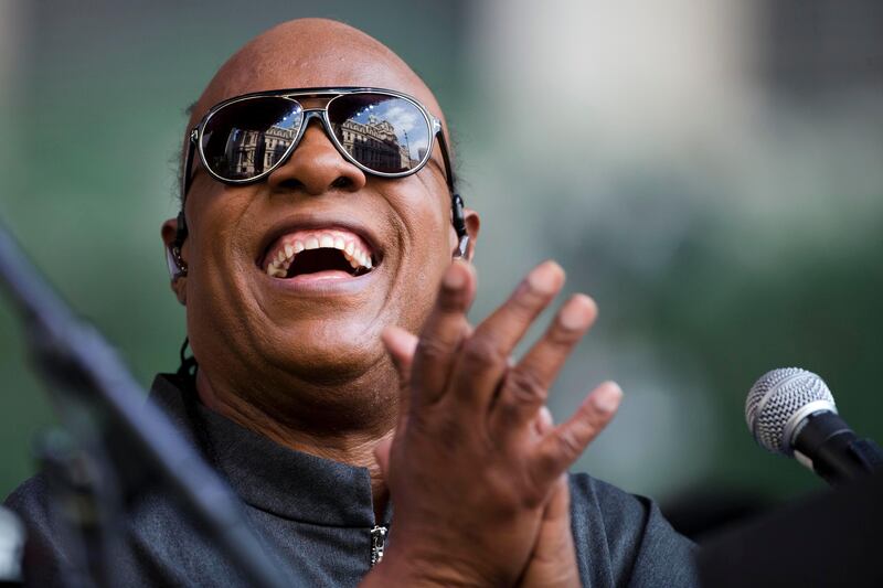 FILE - In this Aug. 17, 2015, file photo, musician Stevie Wonder performs during a free pop-up concert in Philadelphia. Stevie Wonder, Green Day, The Killers, The Lumineers and The Chainsmokers will perform at the Sept. 23, 2017, Global Citizen Festival, an annual free event held in New Yorkâ€™s Central Park. (AP Photo/Matt Rourke, File)