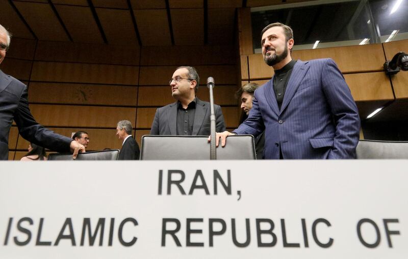 Iran's Ambassador to the International Atomic Energy Agency, IAEA, Gharib Abadi, right, waits for the start of the IAEA board of governors meeting at the International Center in Vienna, Austria, Monday, Sept. 9, 2019. (AP Photo/Ronald Zak)