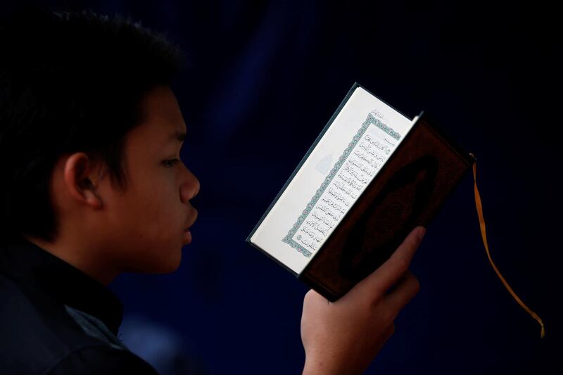 A boy reads the Koran during Ramadan at a mosque in Jakarta, Indonesia. Reuters