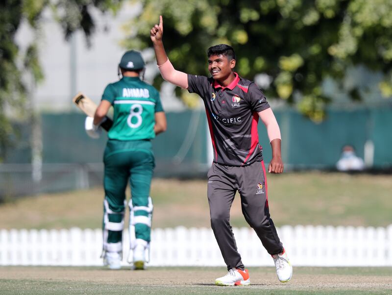 The UAE's Aayan Afzal Khan takes the wicket of Pakistan's Mehran Mumtaz in the game between the UAE and Pakistan during the Under 19 Asian Cup at the ICC Academy, Dubai. Chris Whiteoak/ The National