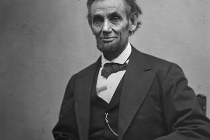 In this photo provided by the Library of Congress, President Abraham Lincoln, seated and holding his spectacles and a pencil on Feb. 5, 1865. (AP Photo/Library of Congress/Alexander Gardner)