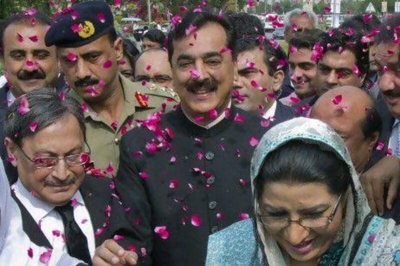 Yusuf Raza Gilani, the Pakistan prime minister, is showered in rose petals by his supporters at the Supreme Court in Islamabad. Mr Gilani was found guilty of contempt of court which some analysts say will spark fresh legal and political battles in the country.