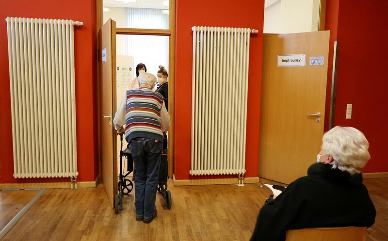 An elderly man enters a COVID-19 vaccination centre temporarily set up in a former cinema in Weimar, Germany, January 13, 2021. REUTERS/Karina Hessland REFILE - CORRECTING GENDER