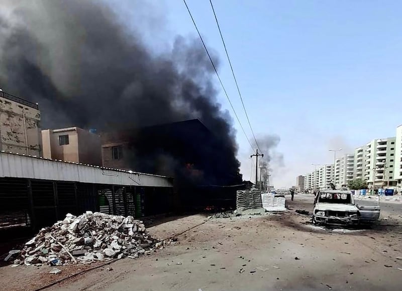 A building in Khartoum burns as violence rages in Sudan. EPA