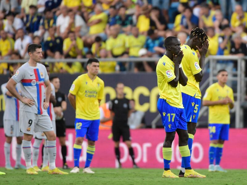 Cadiz players Momo Mbaye and Awer Mabil wait during a play interruption. AFP