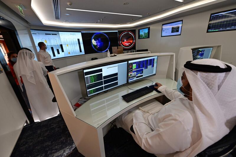 Employees work at the control room of the Mars Mission at the Mohammed Bin Rashid Space Centre. AFP