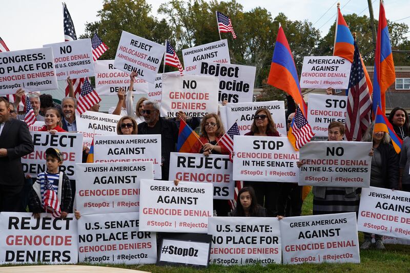 Protesters hold up signs against US Senate candidate Mehmet Oz, who is running for a seat in the battleground state of Pennsylvania. All photos: Katarina Holtzapple