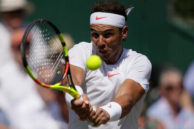 Rafael Nadal of Spain returns to Lucas Pouille of France during day four of the Aspall Classic at the Hurlingham Club, London, Friday, June 29, 2018. (Tim Ireland/PA via AP)