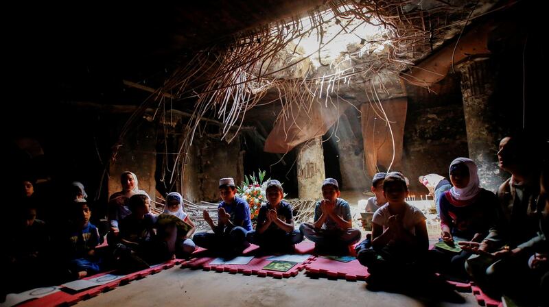 Children at a Quran reading lesson at the Amiriya shelter in Baghdad, Iraq. Reuters