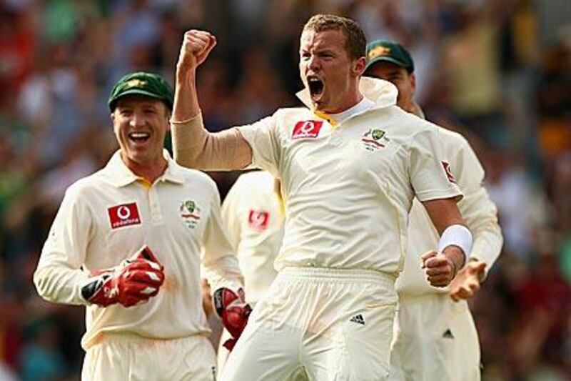 Peter Siddle, of Australia, celebrates after claiming the wicket of England’s Matt Prior on day one of the first Ashes Test at The Gabba yesterday. Siddle was so pumped, he went on take a hat-trick thereafter.