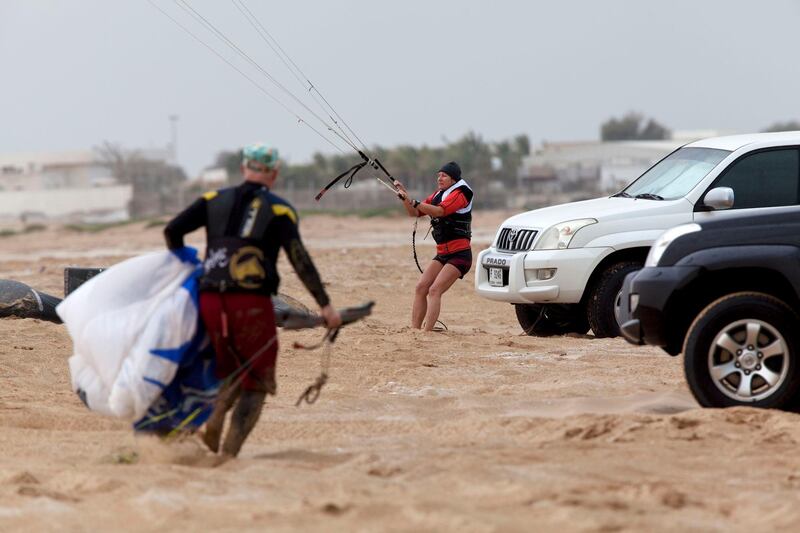 Ras al-Khaimah, United Arab Emirates, March 21, 2013:    A group of kite-surfers pack up their kit as severe weather rolls in south of Al Harma in Ras al-Khaimah on March 21, 2013. Christopher Pike / The National