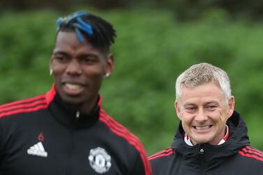 MANCHESTER, ENGLAND - OCTOBER 13: (EXCLUSIVE COVERAGE) Paul Pogba and Manager Ole Gunnar Solskjaer of Manchester United in action during a first team training session at Carrington Training Ground on October 13, 2021 in Manchester, England. (Photo by Tom Purslow/Tom Purslow)