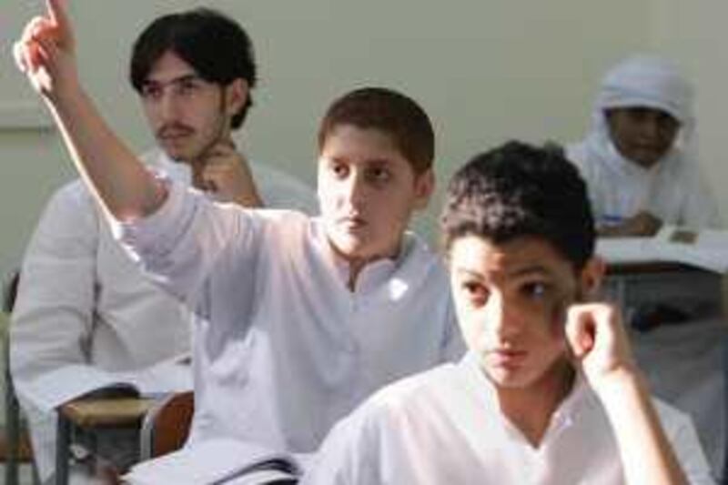 United Arab Emmirates - Abu Dhabi - Sep 24 - 2008 : Children participate in a class at Mohamed bin Khaled School. ( Jaime Puebla / The National ) *** Local Caption ***  JP 106 - MOHAMED BIN KHALED SCHOOL.jpgJP 106 - MOHAMED BIN KHALED SCHOOL.jpg