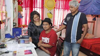 Pritvik Sinhadc pictured with mother Indira Dharchaudhuri and father Bhaskar Sinha at their home in Jumeirah Village Circle in Dubai last year. Pawan Singh/ The National