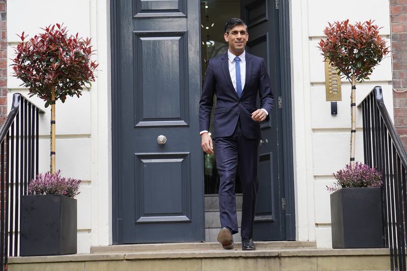 Prime Minister Rishi Sunak leaves the Conservative Party headquarters in central London, after the party suffered council losses in the local elections. PA