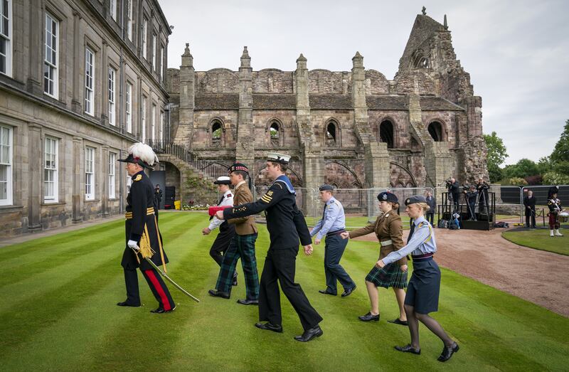 Governor of Edinburgh Castle Alastair Bruce leads cadets during the parade in the gardens of the palace. PA
