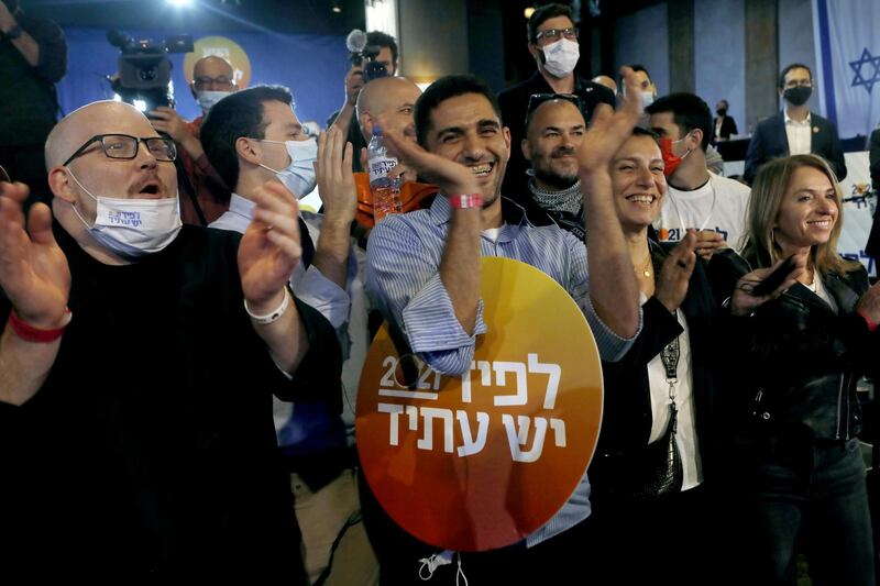 Supporters cheer during a Yesh Atid party event in Tel Aviv, Israel. Bloomberg