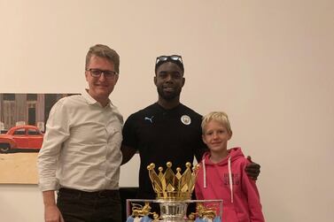 Nick March, Assistant Editor-in-Chief at The National, with his son Robert, right, and Micah Richards. Courtesy Nick March