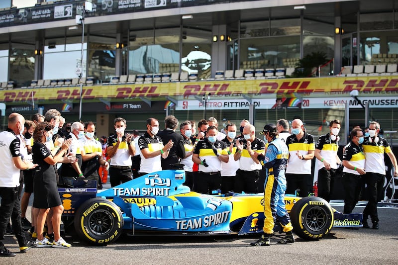 Fernando Alonso and Renault Sport F1 team members with his 2005 F1 title winning Renault R25. Getty