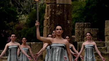 Actress Mary Mina, playing the role of the High Priestess, holds the torch during the Paris 2024 flame lighting ceremony in Olympia, Greece. Getty Images