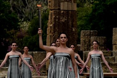 Actress Mary Mina, playing the role of the High Priestess, holds the torch during the Paris 2024 flame lighting ceremony in Olympia, Greece. Getty Images