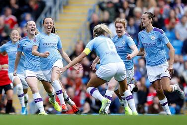 Manchester City's Caroline Weir, centre, celebrates after scoring the winning goal against Manchester United in the Women's Super League at the Etihad Stadium on Sunday. Reuters