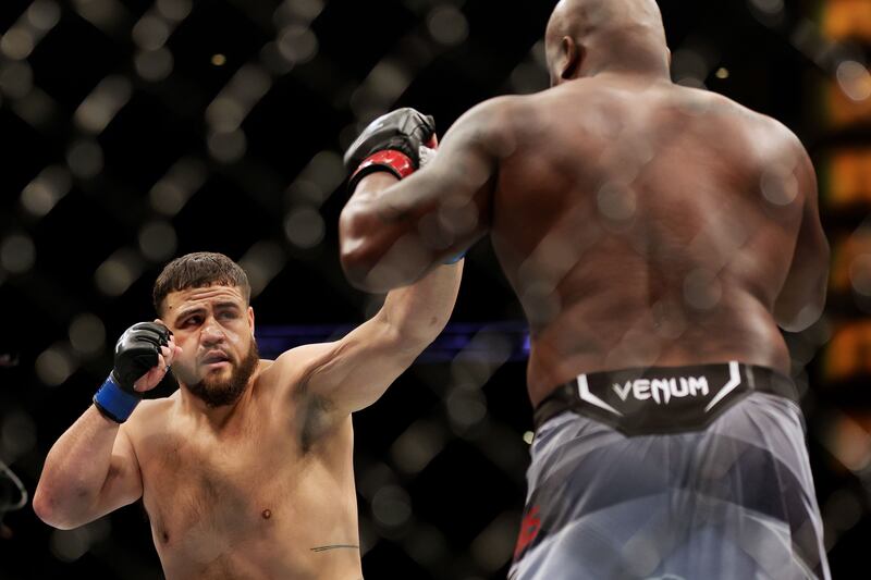 Tai Tuivasa exchanges strikes with Derrick Lewis in their heavyweight fight at UFC 271. Getty Images