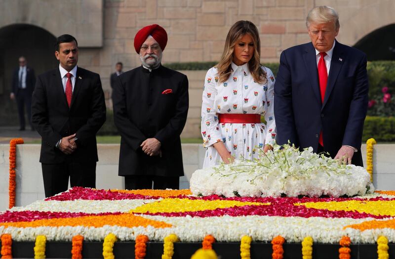 US President Donald Trump and first lady Melania Trump attend a wreath laying ceremony at Mahatma Gandhi's memorial at Raj Ghat in New Delhi, India. Reuters