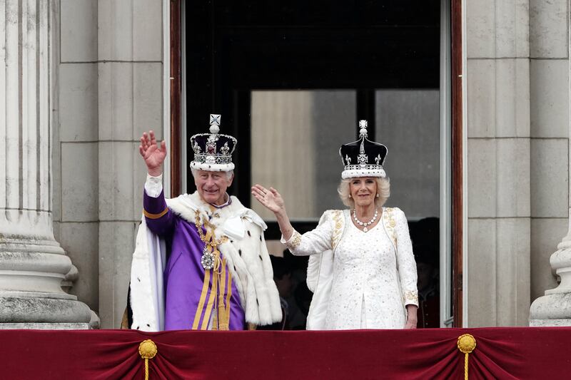 King Charles III and Queen Camilla on the balcony of Buckingham Palace, London, following the coronation. PA