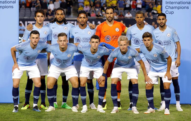 Manchester City players gather for a team group photo before the match. Reuters