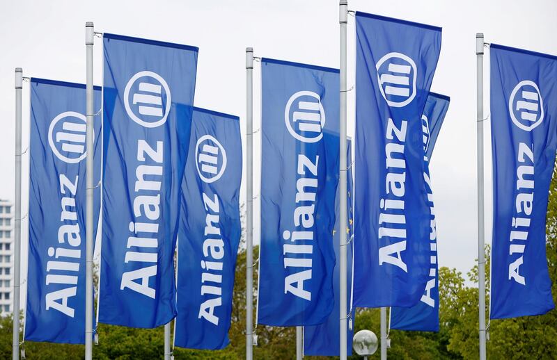 FILE PHOTO: Flags with the logo of Allianz SE, Europe's biggest insurer, are pictured before the company's annual shareholders' meeting in Munich, Germany May 3, 2017. REUTERS/Michaela Rehle/File Photo