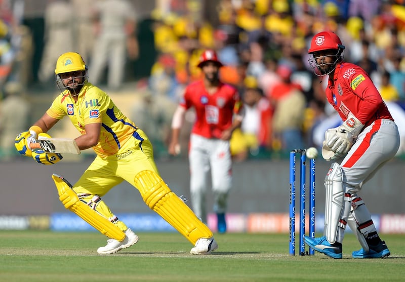 Chennai Super Kings cricketer Suresh Raina (L) plays a shot during the 2019 Indian Premier League (IPL) Twenty20 cricket match between Kings XI Punjab and Chennai Super Kings at the Punjab Cricket Association Stadium in Mohali on May 5, 2019. (Photo by Sajjad HUSSAIN / AFP) / ----IMAGE RESTRICTED TO EDITORIAL USE - STRICTLY NO COMMERCIAL USE-----