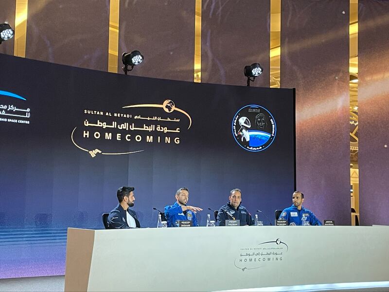 From left, Saud Karmustaji, director of strategic communication at the Mohammed bin Rashid Space Centre, Dr Al Neyadi, Salem Al Marri, MBRSC director general and Hazza Al Mansouri, the first Emirati in space, speak at Abu Dhabi International Airport's Terminal A. Khushnum Bhandari / The National