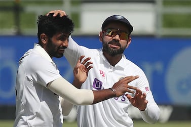 Cricket - Third Test - South Africa v India - Newlands Cricket Ground, Cape Town, South Africa - January 12, 2022 India's Jasprit Bumrah celebrates with Virat Kohli after taking the wicket of South Africa's Keegan Petersen REUTERS / Sumaya Hisham
