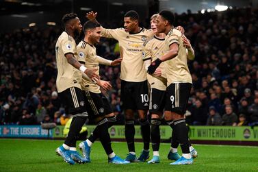 Manchester United striker Anthony Martial (R) celebrates scoring the opening goal at Burnley with team-mates Fred (L), Andreas Pereira, Marcus Rashford and Brandon Williams. AFP