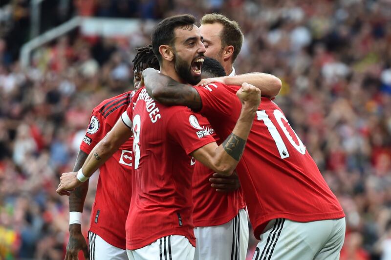 Manchester United players celebrate after Marcus Rashford scored their third goal.  EPA