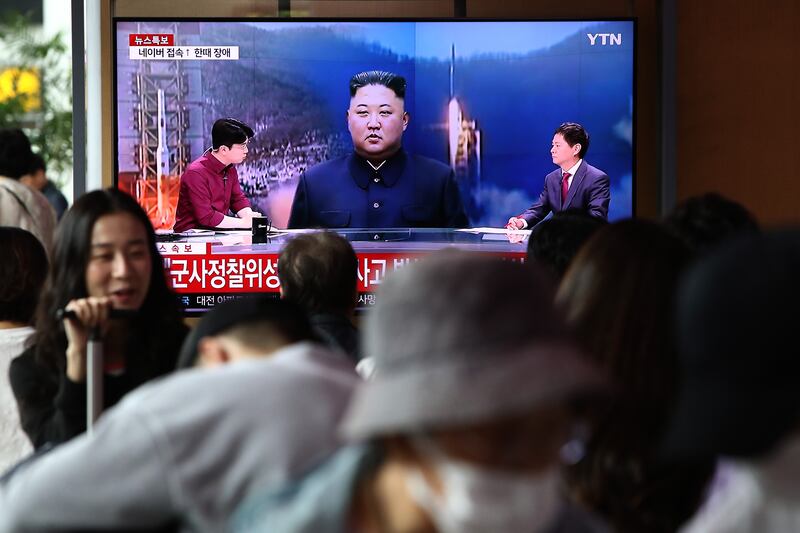 A TV broadcast shows an image of North Korean leader Kim Jong-un at Seoul Railway Station. Getty