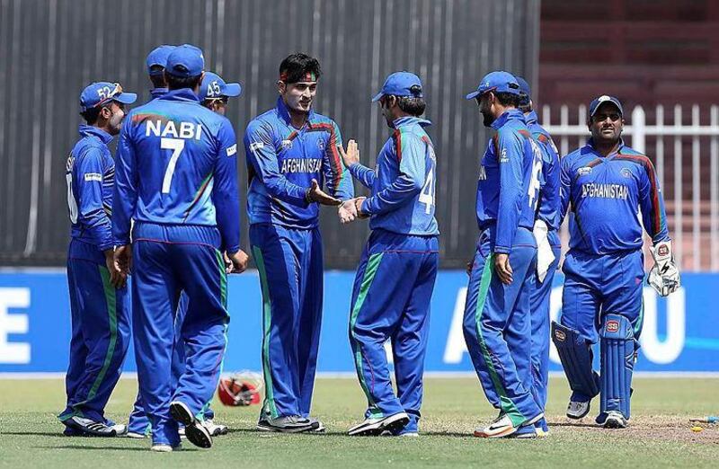 Hamid Hassan, with hair band, and his Afghanistan teammates look unstoppable. Pawan Singh / The National