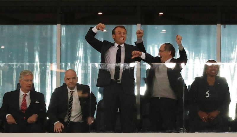 President of France Emmanuel Macron celebrates as King Philippe of Belgium looks on. Reuters