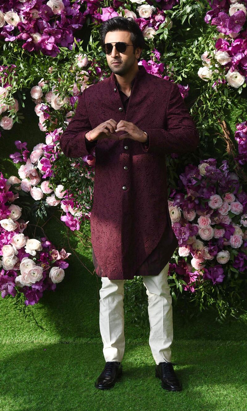 Bollywood actor Ranbir Kapoor poses for photographs as he arrives to attend the wedding ceremony of Akash Ambani. Photo: AFP