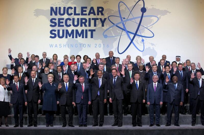 US president Barack Obama and other world leaders wave during a photo session at the Nuclear Security Summit in Washington, on April 1, 2016. Jacquelyn Martin / AP Photo