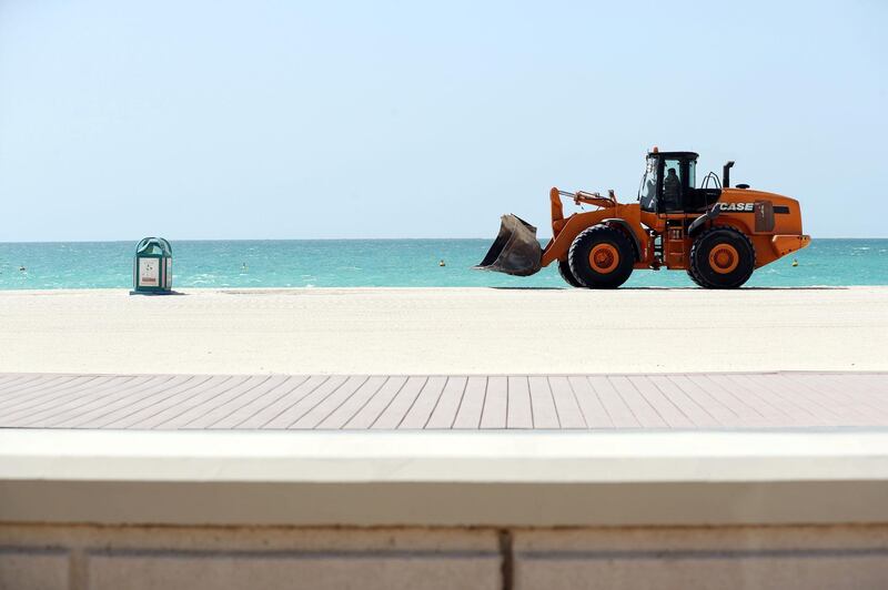 Dubai, United Arab Emirates - Reporter: N/A: Corona. A digger does some work on an empty Jumeirah beach, this is normally a very popular spot for beach goers. Tuesday, April 14th, 2020. Dubai. Chris Whiteoak / The National
