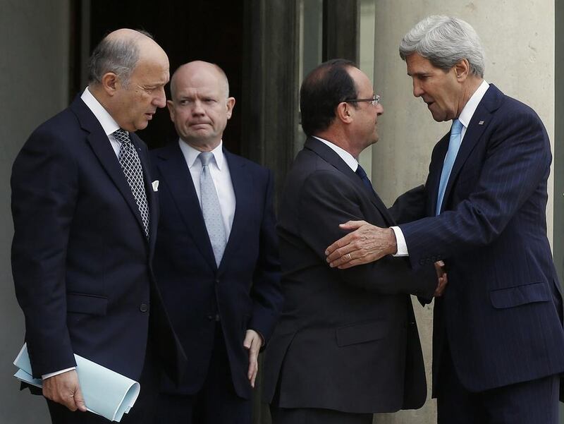 U.S. Secretary of State John Kerry, right, speaks with French President Francois Hollande, second from right, before taking leave as French Foreign Minister Laurent Fabius, left, and British Foreign Secretary William Hague stand alongside following their meeting on Syria, at the Elysee palace, Paris, Monday, Sept. 16, 2013.  (AP Photo/Larry Downing, Pool) *** Local Caption ***  France Syria Diplomacy.JPEG-0a350.jpg