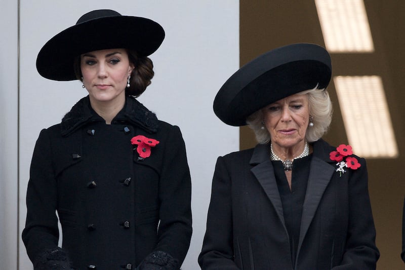 Kate, Princess of Wales, left, wearing Queen Elizabeth II's Bahraini pearl earrings. She first wore them in public while attending the Remembrance Sunday ceremony with Camilla, Queen Consort in November 2016. AFP 