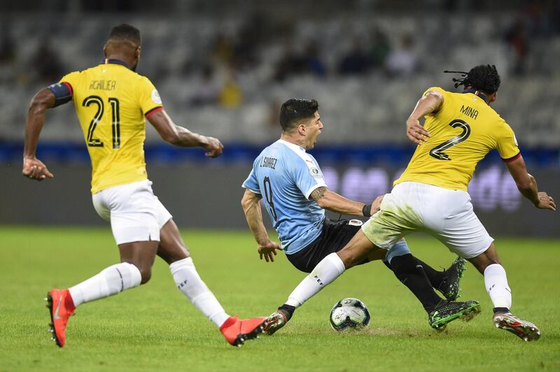 Luis Suarez of Uruguay fights for the ball with Arturo Mina of Ecuador during the Copa America Brazil 2019 group C match between Uruguay and Ecuador at Mineirao Stadium.  Getty Images